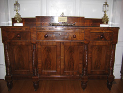 A mahogany wood and mahogany wood veneer side board circa 1850.